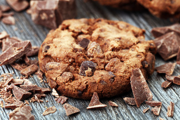 Chocolate cookies on wooden table. Chocolate chip cookies shot