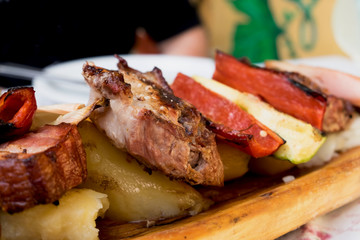 Serbian specialities known as rostilj include grilled pork neck, beef steak and vegetables 