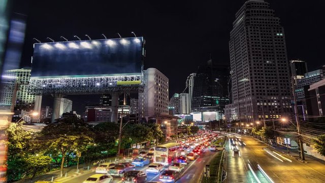 4K resolution Timelapse Cinemagraph,  Big blank billboard beside the road at night, Advertising background for add your text promotion or product in scene traffic communication