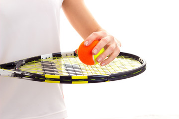 Woman with tennis racquet and ball