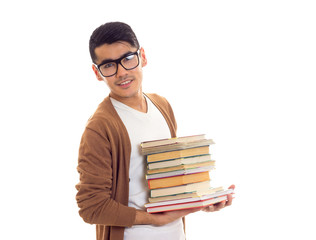 Young man in glasses with books