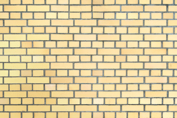 Background of yellow brick wall texture.