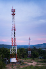 Communication towers in twilight.