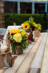 Fototapeta na wymiar Sunflower the glass jar. Flower decoration. Wedding, party design