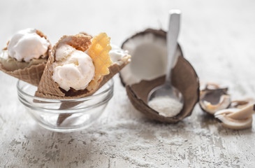 Vanilla-coconut ice cream in a waffle cone