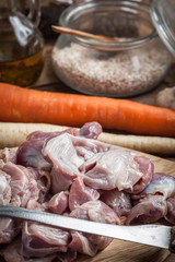 Preparing to cook raw chicken stomach.