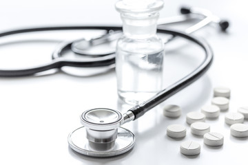 medicine set with pills and stethoscope on doctor's workplace background