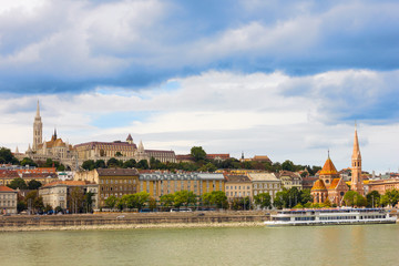Fototapeta premium View of the Buda side of Budapest on a sunny day by the Danube river