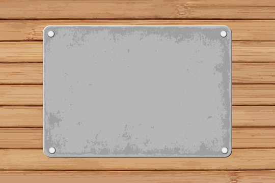 grunge plaque on wooden background