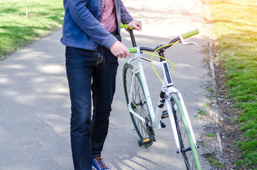 A man on a bicycle in the park. Close up