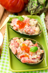 Stuffed avocado with tomato, garlic and mayonnaise