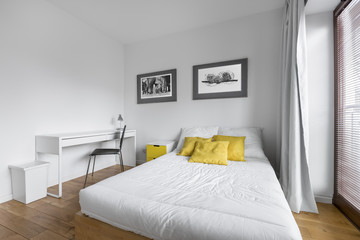 White bedroom with twin-size bed