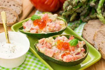 Stuffed avocado with tomato, garlic and mayonnaise