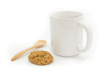 the cup of coffee with wooden spoon  and chocolate almond cookies are isolated on the white