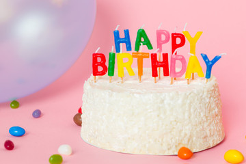 Happy Birthday cake on pink background