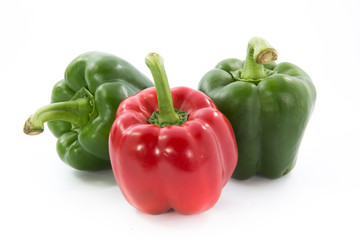 Red and green capsicum or sweet pepper isolated on white background