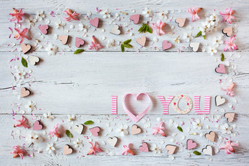 Wooden background with flowers and text declaration of love