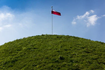 Polish national flag at the summit of liberation mound