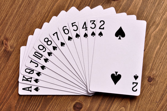 Set of play cards poker casino on  a wooden background