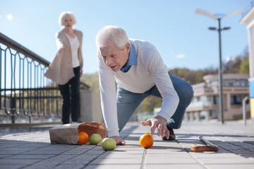 Fototapeta premium Old man falling down in the street
