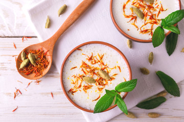 Traditional Indian lassi curd with cardamon, mint and saffron