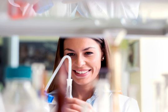 Scientist carrying out experiment in research laboratory. Medical chemist lab.