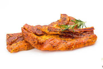 Spicy marinated spare ribs barbecued on the white background.