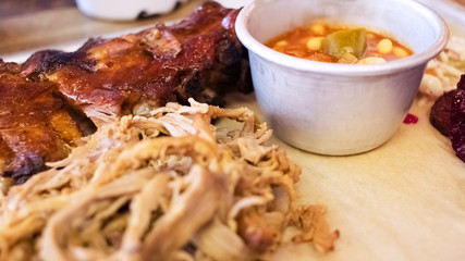 Barbecue food, ribs, pulled pork, beans, coleslaw. BBQ
