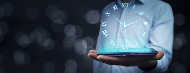 Businessman hand phone  with  clock