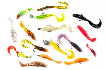 Colorful silicone plastic fishing baits isolated on white background. Top view