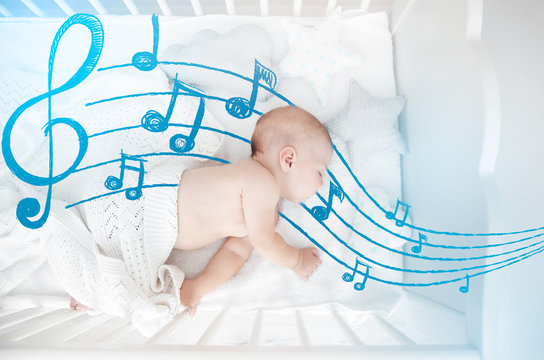 Little baby sleeping in crib , top view