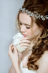 Brunette bride in fashion white wedding dress with makeup