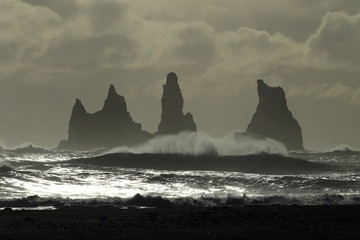 Reynisdrangar Sea Stacks, Iceland waves breaking on Renisfjara beach in front of the Reynisdrangar...