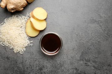 Composition with tasty soy sauce on grey textured background