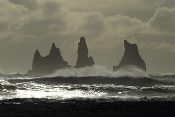 Reynisdrangar Sea Stacks, Iceland waves breaking on Renisfjara beach in front of the Reynisdrangar...