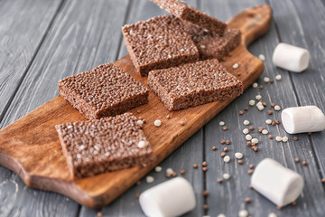 Chocolate crispy dessert on wooden background