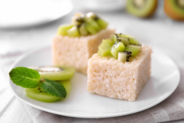 Delicious crispy dessert with kiwi on plate