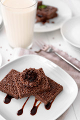 Chocolate crispy dessert on white plate