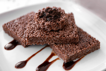 Chocolate crispy dessert on white plate