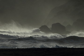 Reynisdrangar Sea Stacks, Iceland waves breaking on Renisfjara beach in front of the Reynisdrangar...