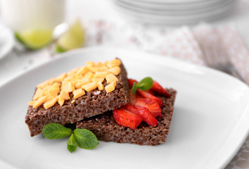 Chocolate crispy dessert with strawberry on plate
