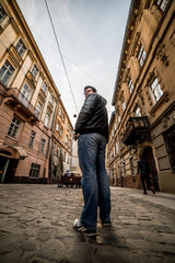 man walking by old europian city