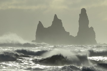 Reynisdrangar Sea Stacks, Iceland waves breaking on Renisfjara beach in front of the Reynisdrangar...
