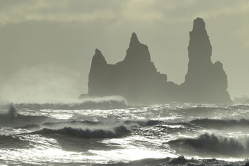 Reynisdrangar Sea Stacks, Iceland waves breaking on Renisfjara beach in front of the Reynisdrangar...