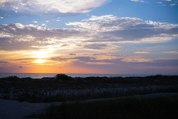 A look at the sunset from the sand dunes on Venice beach in southwest Florida.