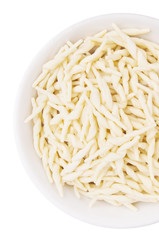 Italian handmade organic Trofie Pasta in bawl isolated on white