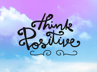 Think positive word on pink and blue pastel sky