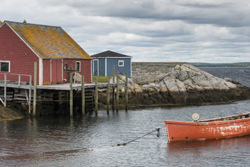 Fototapeta na wymiar Buildings and boat on the oceanfront, Nova Scotia, Canada