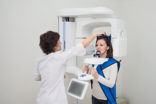 Dentist taking a panoramic digital X-ray of a patients teeth