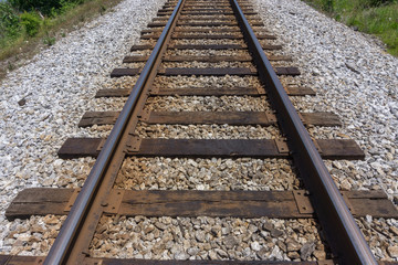 Fototapeta na wymiar Railroad Tracks leading to the Mountains